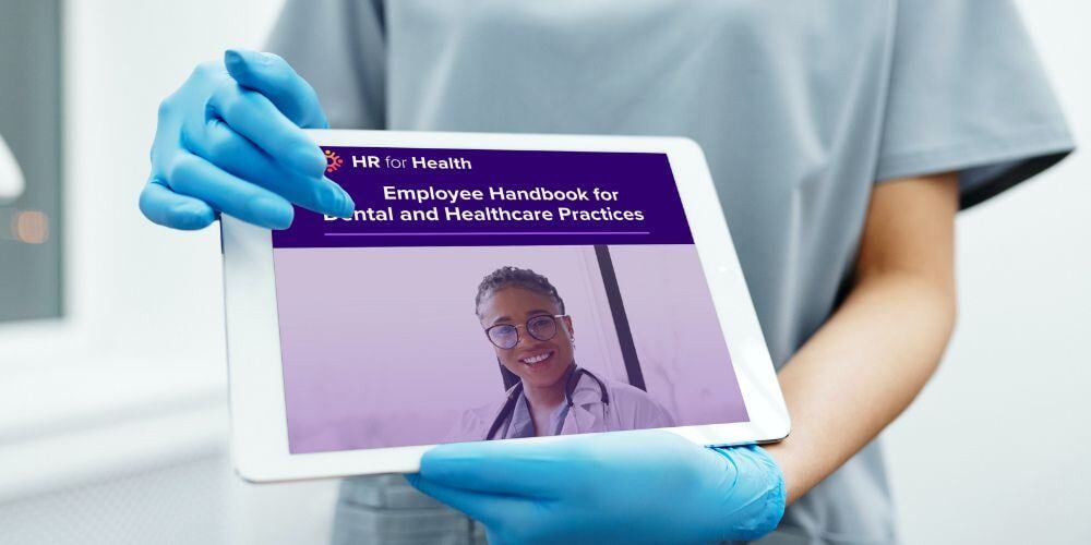 employee handbook held by doctor